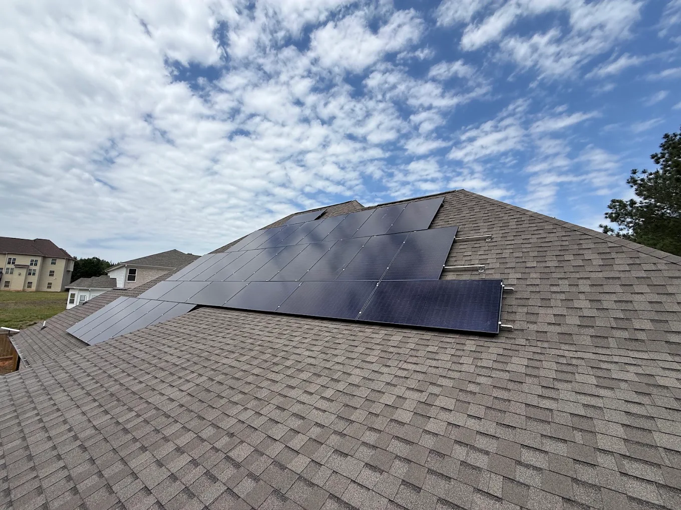 Rooftop solar panel installation on a suburban home in Georgia
